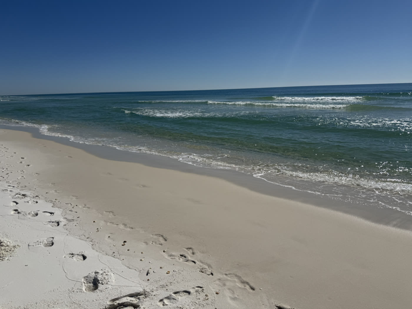 Boat resting in clear shallow coastal water