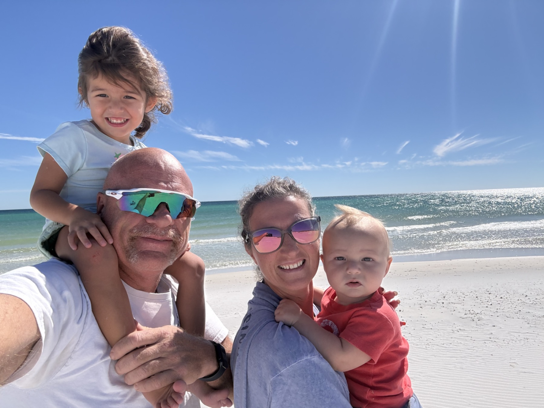 Justin, Jessica, and their grandchildren visiting Navarre Beach on October 17, 2026