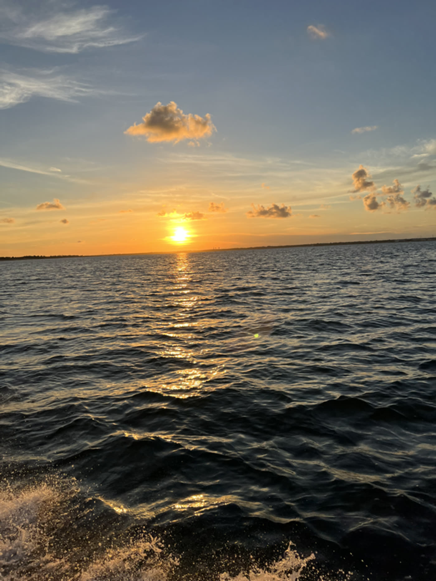 Golden sunset reflected across open water